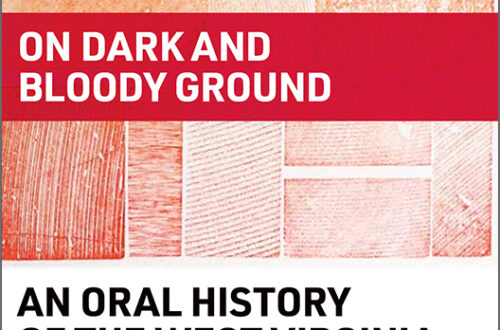 An Oral History of the West Virginia Mine Wars cover, wood grain print in red, orange, and yellow