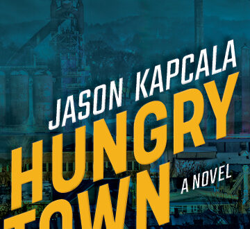 Hungry Town cover: title and author name in yellow and white letters with a blue tinted photograph of a factory town in the background